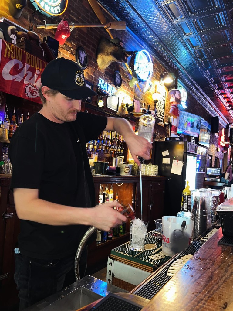 Bartender pouring a drink