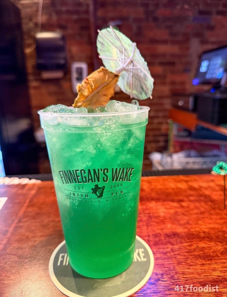 Green cocktail in a Finnegan's Wake cup
